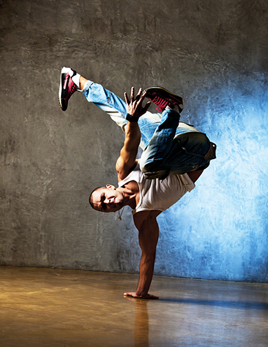 a hip hop dancer in one-arm pose